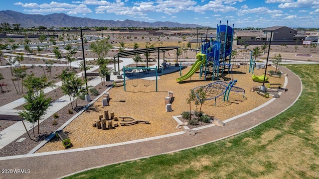 view of playground featuring a mountain view