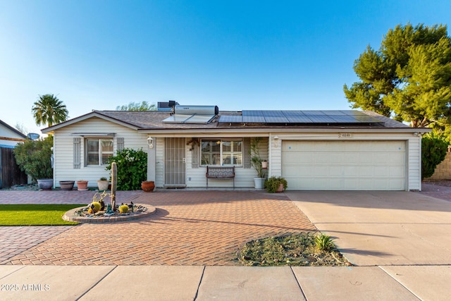 4046 E Crocus Dr, Phoenix, AZ 85032 - single story home featuring concrete driveway, roof mounted solar panels, a garage, and a porch