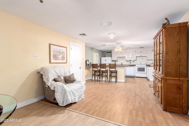 4046 E Crocus Dr, Phoenix, AZ 85032 - living room with light wood finished floors and ceiling fan