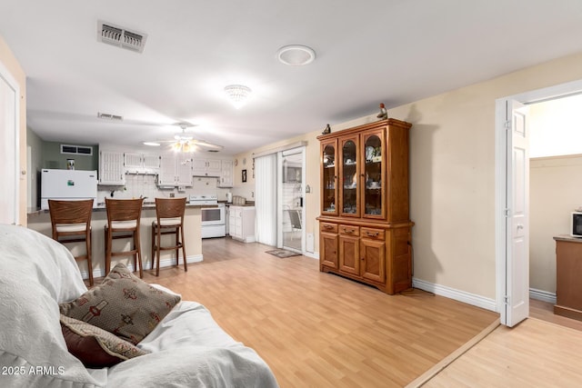 4046 E Crocus Dr, Phoenix, AZ 85032 - living room with light wood-type flooring and a ceiling fan