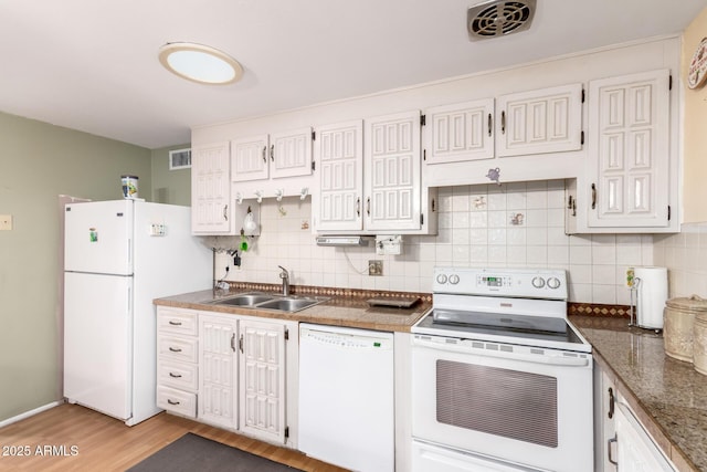 4046 E Crocus Dr, Phoenix, AZ 85032 - kitchen featuring white appliances, tasteful backsplash, light wood-style floors, and white cabinets