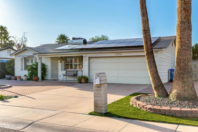 4046 E Crocus Dr, Phoenix, AZ 85032 - ranch-style home featuring concrete driveway, covered porch, an attached garage, roof mounted solar panels, and roof with shingles