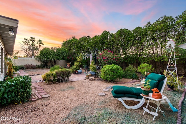 4046 E Crocus Dr, Phoenix, AZ 85032 - yard at dusk with a fenced backyard and a patio area