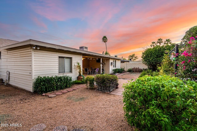 4046 E Crocus Dr, Phoenix, AZ 85032 - back of house at dusk with a patio area