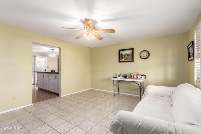 4046 E Crocus Dr, Phoenix, AZ 85032 - tiled living room with a ceiling fan and baseboards
