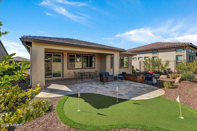 back of property with a patio