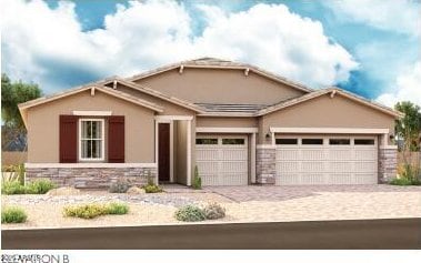 view of front of property with stone siding, stucco siding, an attached garage, and driveway