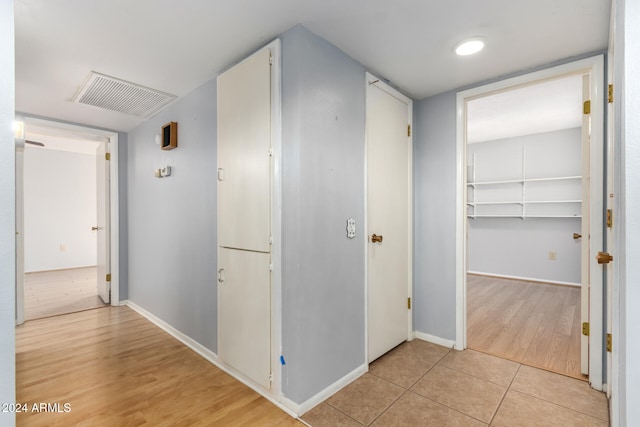 hallway featuring light hardwood / wood-style flooring