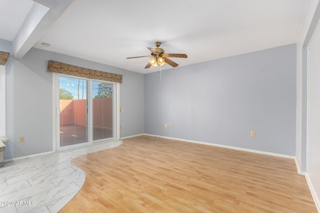 unfurnished living room featuring ceiling fan, light hardwood / wood-style floors, and beam ceiling