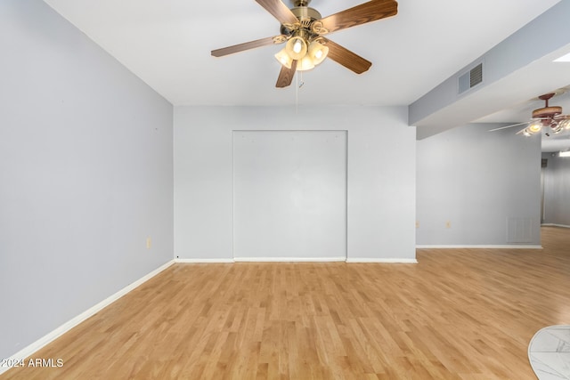 spare room with light hardwood / wood-style flooring