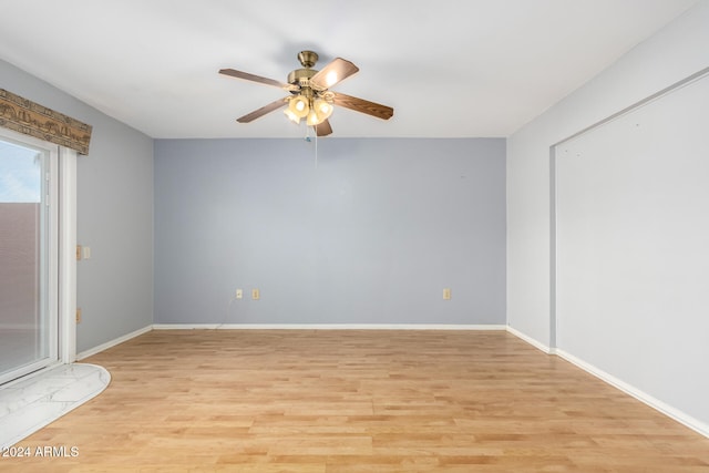 empty room featuring ceiling fan and light hardwood / wood-style floors