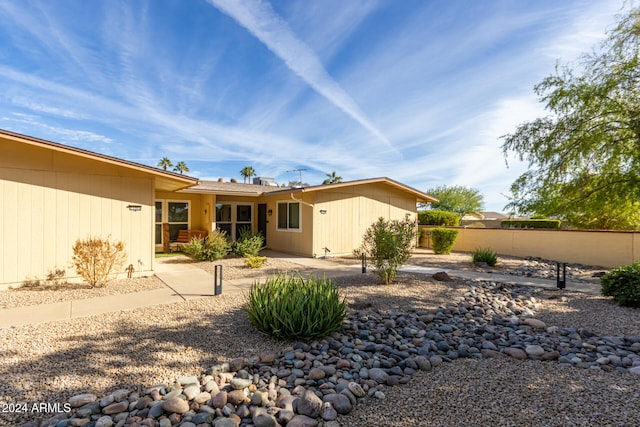 rear view of property featuring a patio area