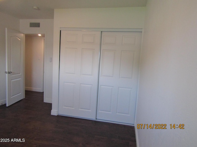 327 E Ln Jolla Dr, Tempe, AZ 85282 - unfurnished bedroom with dark wood-style floors, a closet, and baseboards