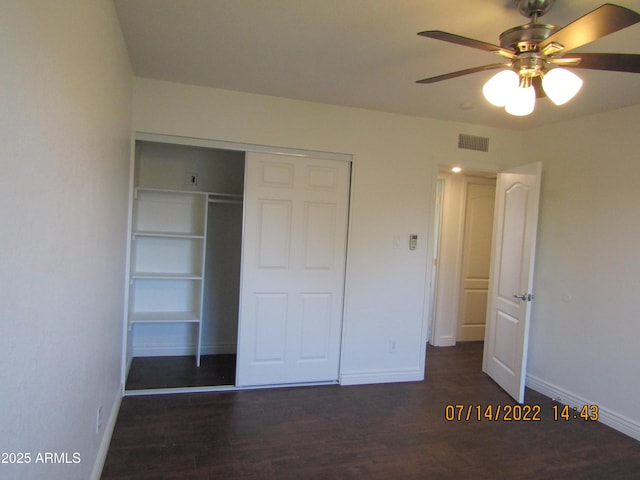327 E Ln Jolla Dr, Tempe, AZ 85282 - unfurnished bedroom with baseboards, wood finished floors, a closet, and ceiling fan