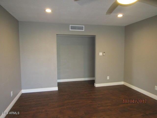 327 E Ln Jolla Dr, Tempe, AZ 85282 - empty room with ceiling fan, wood finished floors, baseboards, and recessed lighting