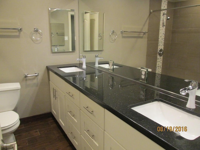327 E Ln Jolla Dr, Tempe, AZ 85282 - bathroom with toilet, double vanity, wood finished floors, and tiled shower