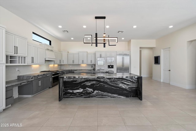 29215 N 136th St, Scottsdale, AZ 85262 - kitchen featuring high end appliances, open shelves, white cabinets, dark stone countertops, and recessed lighting