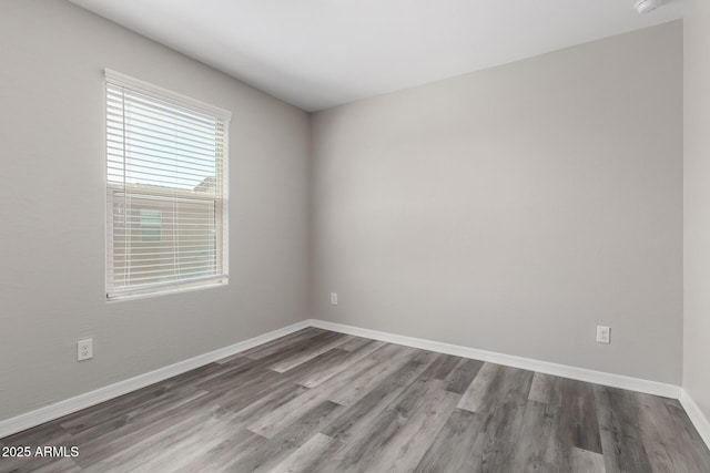 8208 W Albeniz Pl, Phoenix, AZ 85043 - spare room with wood finished floors and baseboards