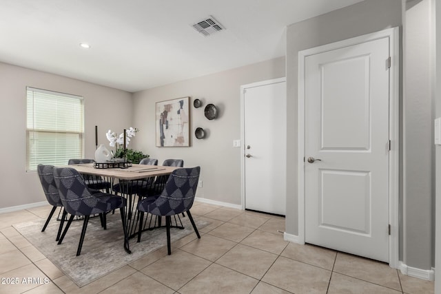 8208 W Albeniz Pl, Phoenix, AZ 85043 - dining area with baseboards and light tile patterned flooring