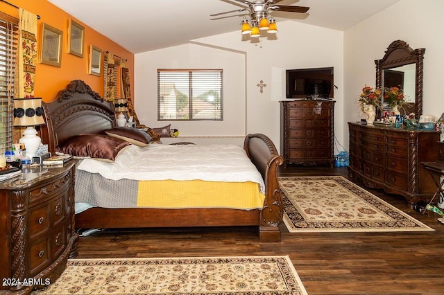 bedroom with lofted ceiling, dark hardwood / wood-style floors, and ceiling fan