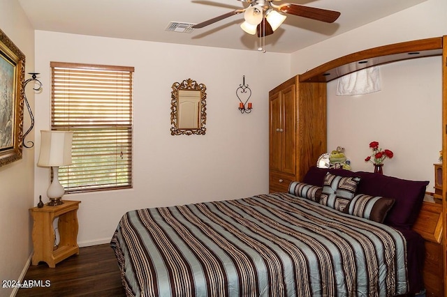 bedroom with ceiling fan and dark hardwood / wood-style flooring