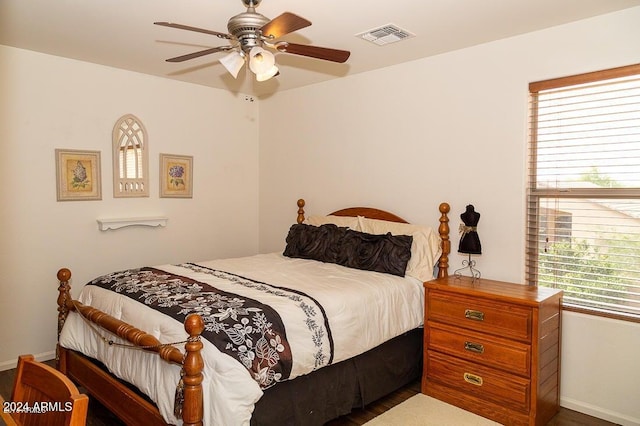 bedroom featuring dark wood-type flooring and ceiling fan