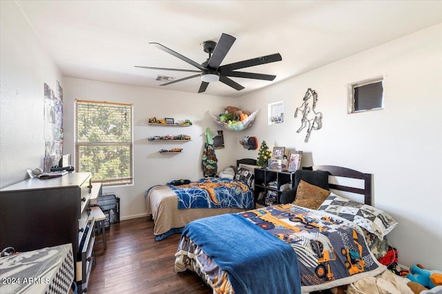 bedroom featuring dark wood-type flooring and ceiling fan