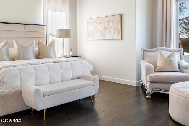 bedroom with dark wood-type flooring