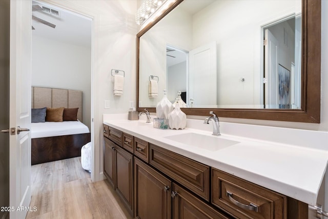 bathroom featuring vanity and hardwood / wood-style flooring