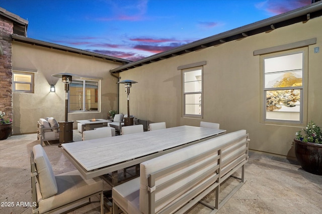 view of patio terrace at dusk