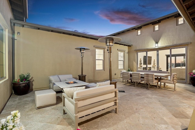 view of patio / terrace featuring an outdoor living space with a fire pit