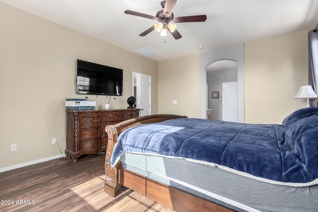 bedroom with ceiling fan and dark hardwood / wood-style floors