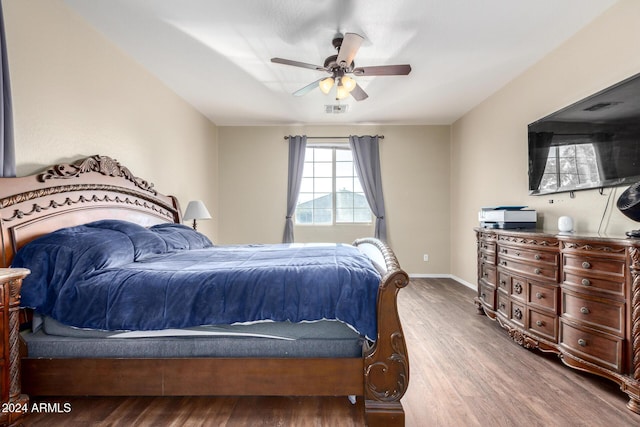 bedroom with hardwood / wood-style flooring and ceiling fan