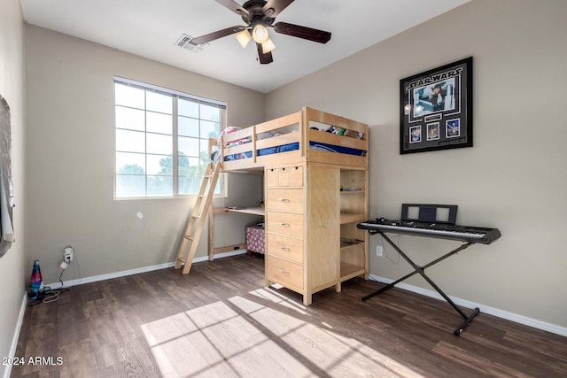 bedroom with ceiling fan and hardwood / wood-style flooring