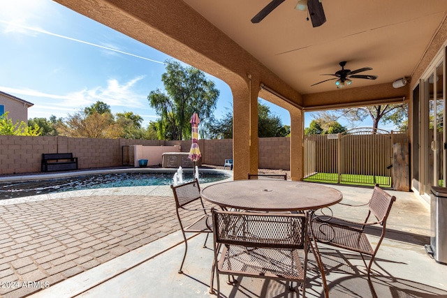 view of patio with pool water feature, ceiling fan, and a fenced in pool