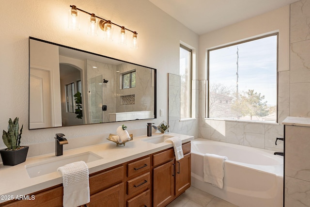 bathroom featuring vanity, tile patterned floors, and shower with separate bathtub