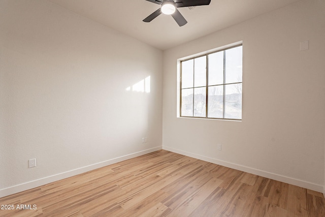 empty room featuring light hardwood / wood-style floors and ceiling fan