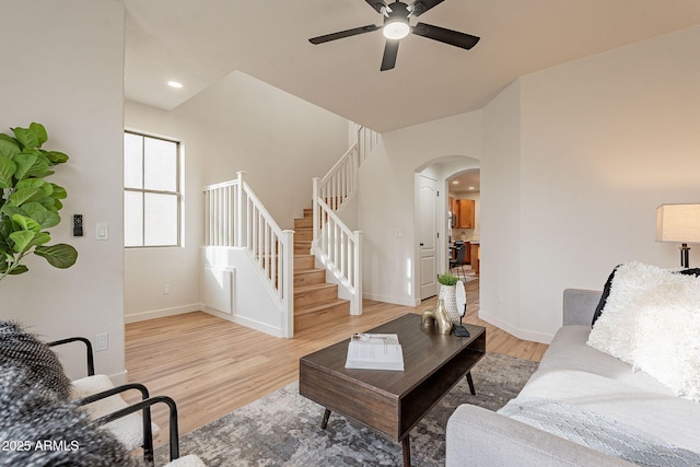 living room with ceiling fan and light hardwood / wood-style floors