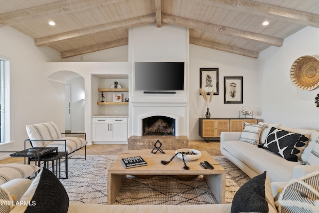 living room featuring built in features, wooden ceiling, and vaulted ceiling with beams