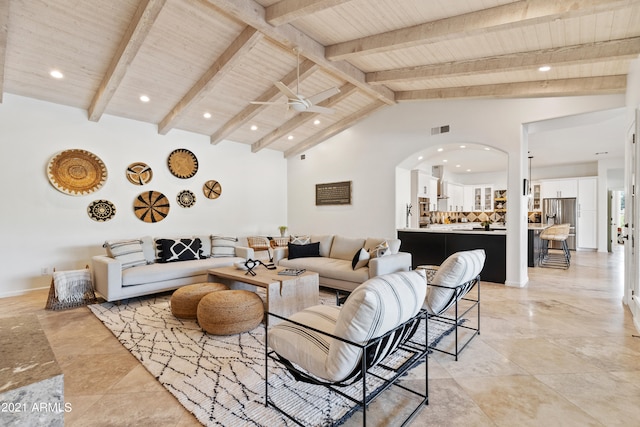 living room featuring wooden ceiling, beam ceiling, high vaulted ceiling, and ceiling fan