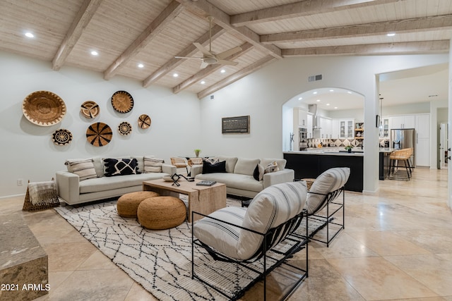 tiled living room with ceiling fan, beamed ceiling, wood ceiling, and high vaulted ceiling