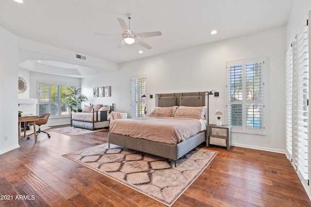 bedroom featuring ceiling fan and dark hardwood / wood-style flooring