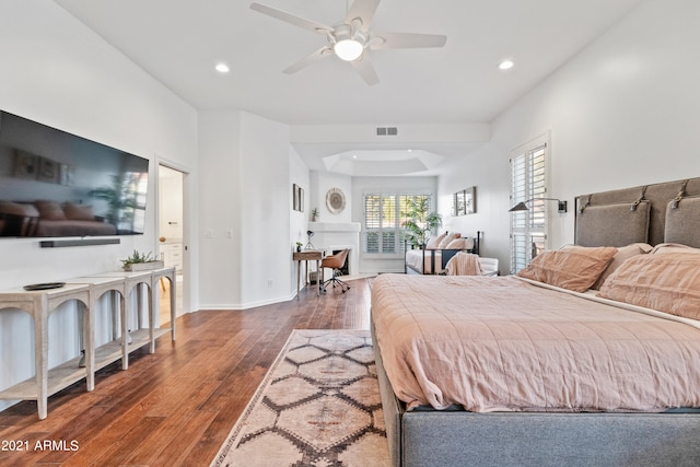 bedroom with ceiling fan and dark wood-type flooring