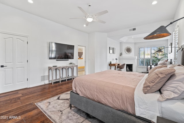 bedroom with ceiling fan and dark hardwood / wood-style floors