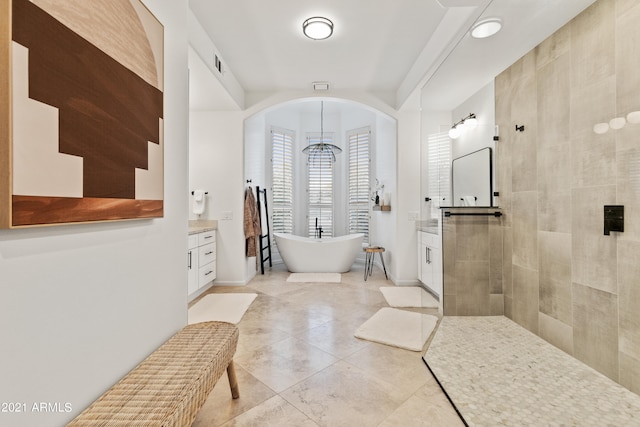 bathroom featuring vanity and plus walk in shower