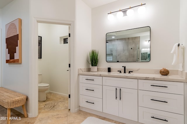 bathroom featuring walk in shower, vanity, and toilet