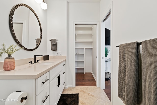 bathroom featuring wood-type flooring and vanity