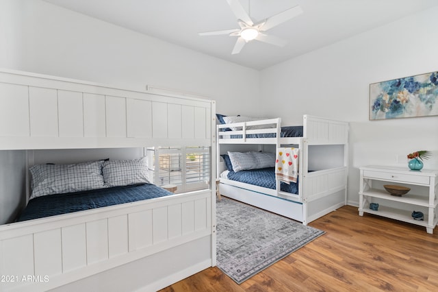 bedroom featuring hardwood / wood-style floors and ceiling fan