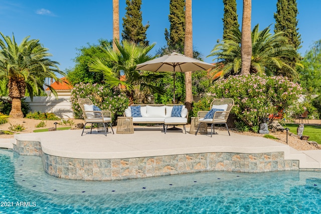 view of pool featuring an outdoor living space and a patio area