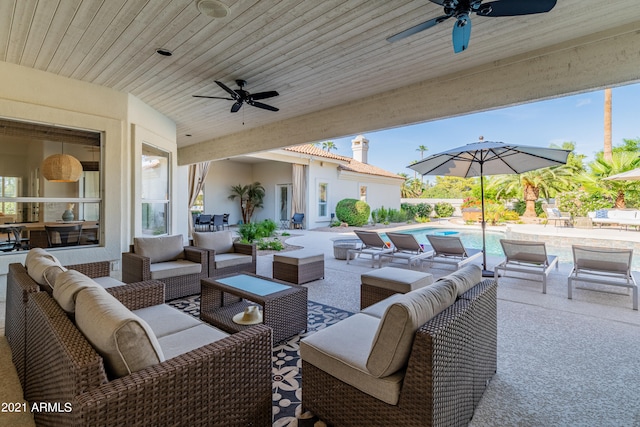 view of patio with outdoor lounge area and ceiling fan